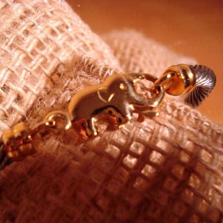Bracelet mixte Eléphant câble acier et or 750