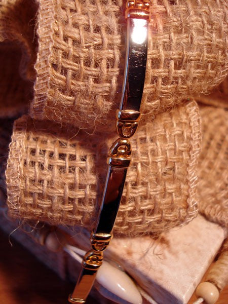 Bracelet articulé acier poli et or 750