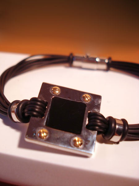 Bracelet acier et or 750 caoutchouc