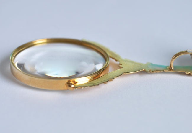 Colgante de lupa de oro amarillo de 750 milésimas