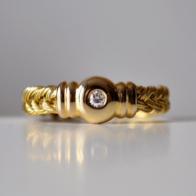Bague tressée or jaune 750 diamant