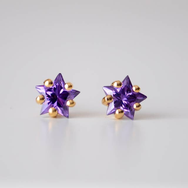 Boucles d'oreilles étoiles mauves zirconiums or jaune 750