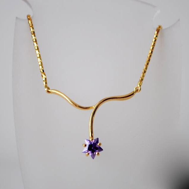 Collier étoile mauve zirconium or jaune 750