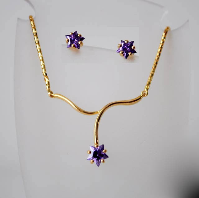 Collier étoile mauve zirconium or jaune 750