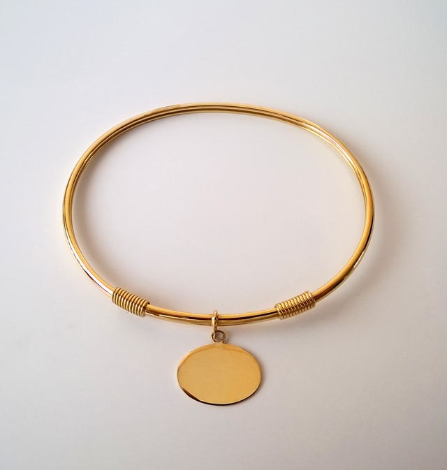 Bracelet jonc plaque ovale or jaune 750