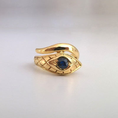 Bague tête serpent saphir rond or jaune 750
