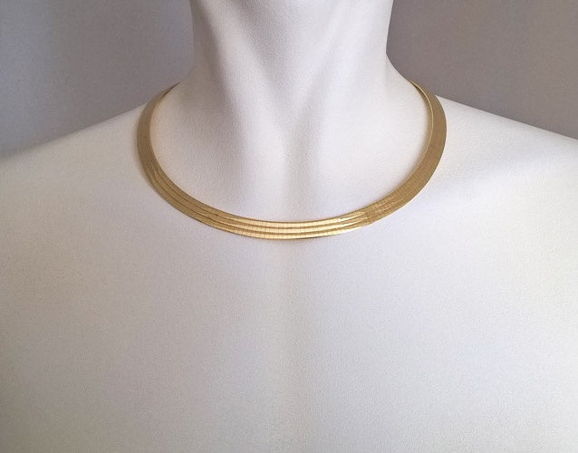 Collier Omega large or jaune 750 Caplain Saint André