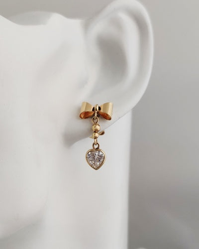 Boucles d'oreilles longues coeurs et noeuds zircon or jaune 750