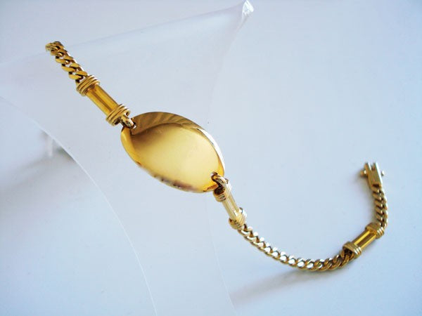 Bracelet massif identité ovale or jaune 750