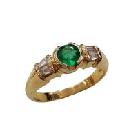 Solitaire accompagné émeraude diamants or 750