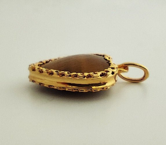 Pendentif coeur bombé oeil de tigre or jaune 750