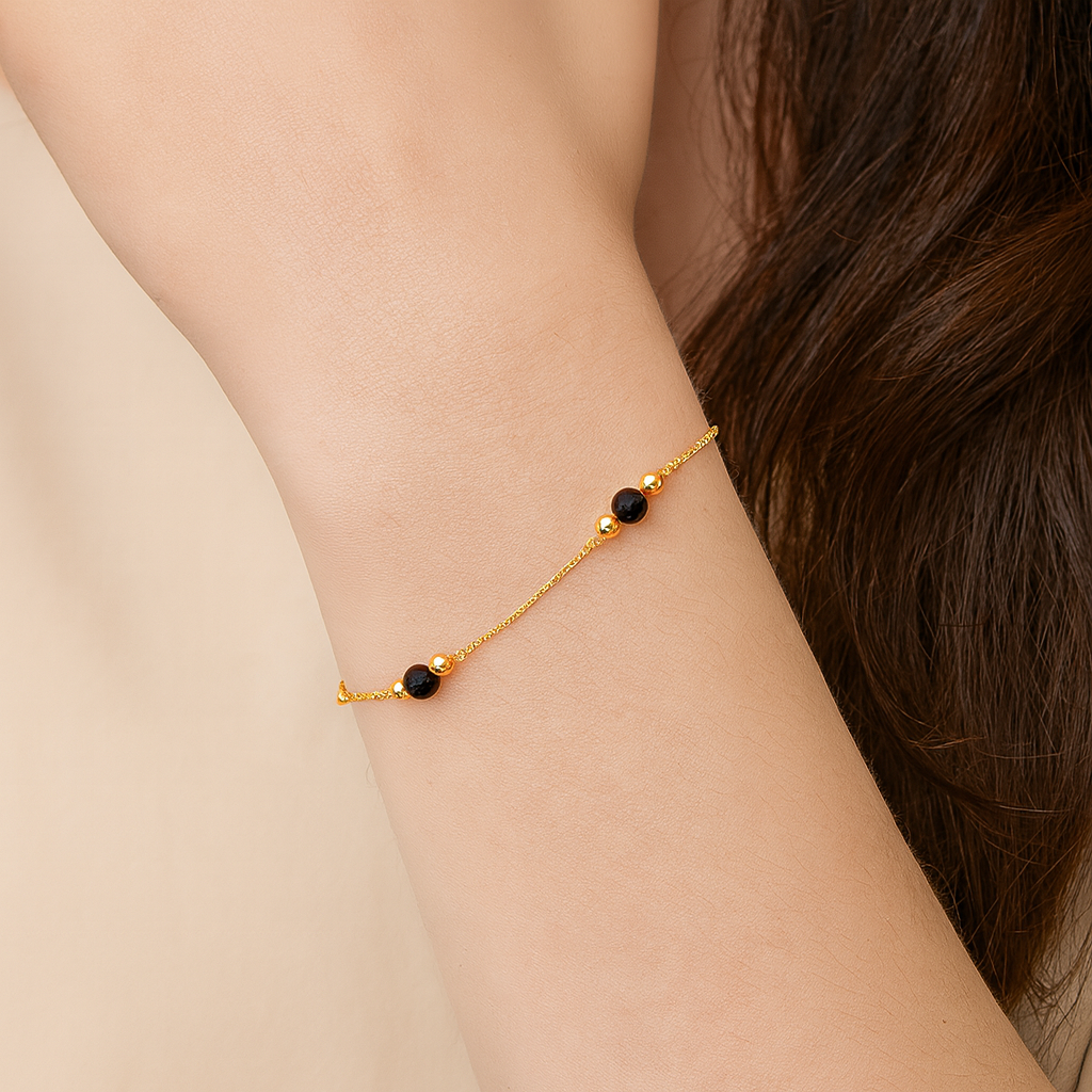 Bracelet fin gourmette boules onyx or jaune 750