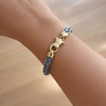 Bracelet acier et or jaune 18 carats câble tressé ourson vue d'ensemble bijouterie Els Benvinguts Andorre