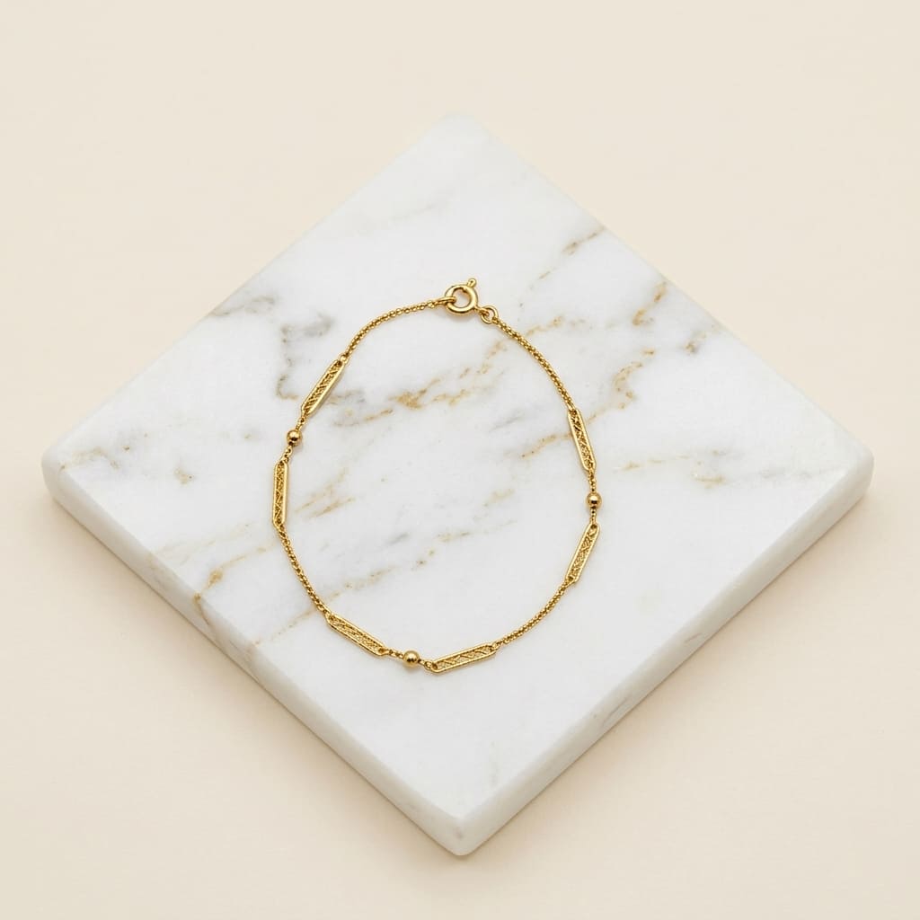 Bracelet filigrane et boules or jaune 750